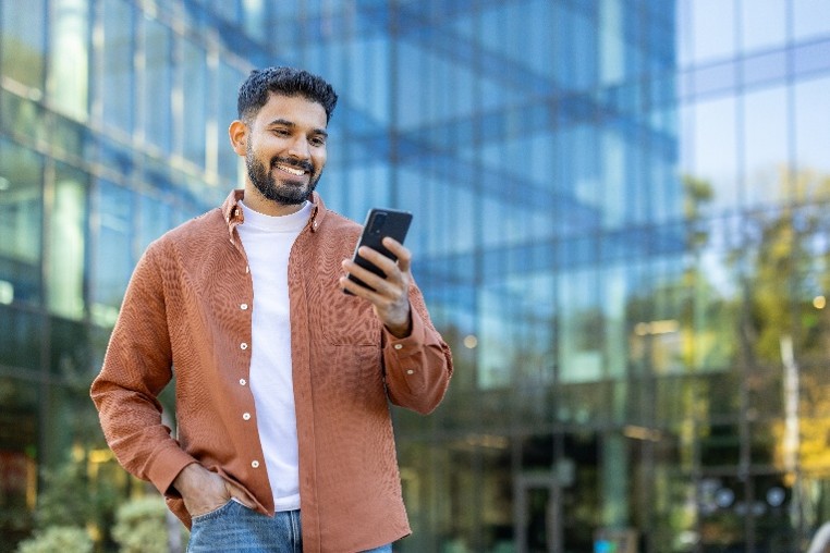 Image a man looking at a phone